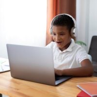 Free-Photo-_-Little-boy-doing-school-online.jpg